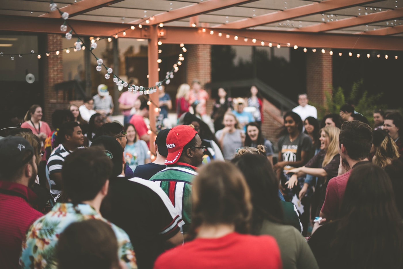 People out together under string lights